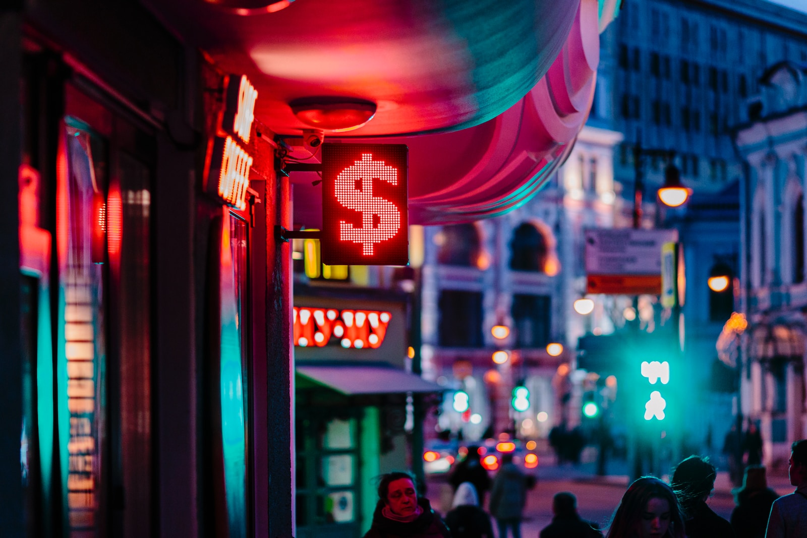 people walking on street during night time